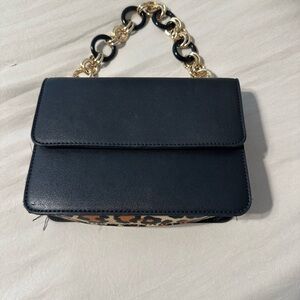 Black Shoulder Bag with Chain Handle and Flap Closure